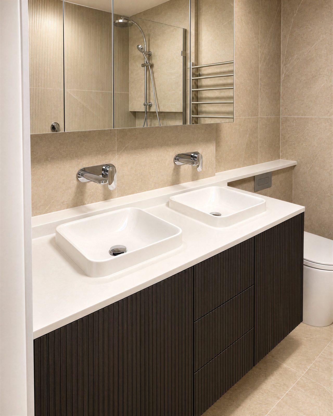 Dark fluted vanity with twin basins and a stone top