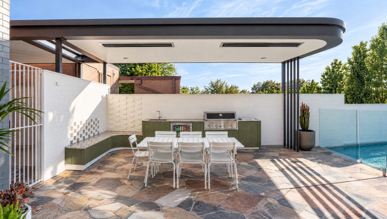 Outdoor kitchen with a curved bench seat